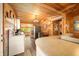 Open kitchen layout with wood-paneled walls, stainless steel appliances, and natural light at 242 W Warford Dr, , IN 46164