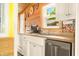 Bright kitchen with white cabinetry and stainless steel dishwasher at 242 W Warford Dr, , IN 46164