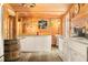 Inviting kitchen with bar area, white cabinets and views to the outside at 242 W Warford Dr, , IN 46164