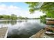 Picturesque lake view from the dock with seating area, enhancing waterfront relaxation at 242 W Warford Dr, , IN 46164
