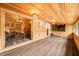 Open concept living room featuring wood paneling, modern flooring, and an adjoining dining area at 242 W Warford Dr, , IN 46164