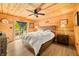 Bright bedroom with wood accents, a sliding door to the outside, and cozy decor at 242 W Warford Dr, , IN 46164