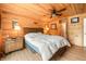 Charming bedroom featuring wood walls, a ceiling fan, and comfortable furnishings at 242 W Warford Dr, , IN 46164