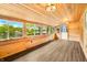Enclosed sunroom with lake views, wood paneling, and plenty of natural light at 242 W Warford Dr, , IN 46164