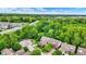 Gorgeous aerial view of a suburban neighborhood and lush greenery, with a nearby highway at 2592 Highmount Ct, Carmel, IN 46033