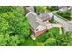 Lovely aerial view of a red brick house with well-kept lawn and a basketball court at 2592 Highmount Ct, Carmel, IN 46033
