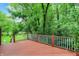 Spacious back deck surrounded by lush trees, perfect for entertaining at 2592 Highmount Ct, Carmel, IN 46033