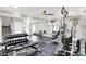 Basement fitness center with free weights, mirrored walls, and workout machines at 2592 Highmount Ct, Carmel, IN 46033