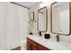 This spacious bathroom features a double vanity, two mirrors, modern fixtures, and ample counter space at 2592 Highmount Ct, Carmel, IN 46033