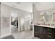 A spacious bathroom with a vanity, walk-in closet, and a makeup vanity at 2592 Highmount Ct, Carmel, IN 46033