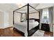 Bright bedroom with a large window, four-poster bed and stylish bedside tables at 2592 Highmount Ct, Carmel, IN 46033
