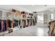 Walk-in closet with built-in shelving and hanging rods for ample storage at 2592 Highmount Ct, Carmel, IN 46033