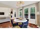 Charming dining room featuring wood floors, modern lighting, and large windows overlooking the yard at 2592 Highmount Ct, Carmel, IN 46033