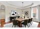 Dining room featuring modern chandelier, neutral walls, and large window for ample natural light at 2592 Highmount Ct, Carmel, IN 46033