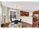 Inviting dining area with wooden floors, neutral walls, and big windows with brick view at 2592 Highmount Ct, Carmel, IN 46033