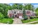 Charming brick two-story home with a well-manicured lawn and mature trees at 2592 Highmount Ct, Carmel, IN 46033