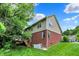 Two-story home with brick and siding, featuring a deck and walk-out basement at 2592 Highmount Ct, Carmel, IN 46033