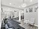 Spacious home gym featuring modern equipment, rubber flooring, and stylish decor at 2592 Highmount Ct, Carmel, IN 46033
