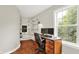 Well-lit office with hardwood floors and plenty of open shelving for storage and decor at 2592 Highmount Ct, Carmel, IN 46033
