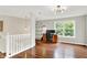 Home office with hardwood floors, natural light, and plenty of open shelving space at 2592 Highmount Ct, Carmel, IN 46033
