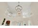 Interior shot of a high ceiling with an elaborate chandelier and detailed railing at 2592 Highmount Ct, Carmel, IN 46033