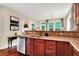 Renovated kitchen featuring cherry cabinets, stainless steel dishwasher, and a large sink at 2592 Highmount Ct, Carmel, IN 46033