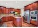 Kitchen with stainless appliances, a central island, and ample counter space at 2592 Highmount Ct, Carmel, IN 46033