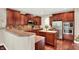 Kitchen featuring granite countertops, dark wood cabinets and backsplash at 2592 Highmount Ct, Carmel, IN 46033