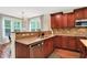 Kitchen featuring a breakfast bar and view of the backyard at 2592 Highmount Ct, Carmel, IN 46033