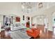 Open-concept living room with hardwood floors and access to other rooms at 2592 Highmount Ct, Carmel, IN 46033
