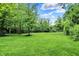Lush green backyard with a playground, perfect for Gathering fun and recreation at 2592 Highmount Ct, Carmel, IN 46033