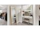 This makeup vanity features a large mirror, makeup organizer, and a plush seat at 2592 Highmount Ct, Carmel, IN 46033