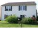 The home's backyard features a well maintained lawn with a black chainlink fence at 2628 Newaygo Dr, Indianapolis, IN 46217
