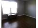 Neutral bedroom with wood-look flooring, natural light, and ample space for personalization and comfort at 2628 Newaygo Dr, Indianapolis, IN 46217