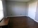 Spacious bedroom featuring wood-look flooring, and closet space for a comfortable and organized living experience at 2628 Newaygo Dr, Indianapolis, IN 46217