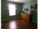 Bright bedroom with wood-look flooring, natural light, and ample space for personalization and comfort at 2628 Newaygo Dr, Indianapolis, IN 46217