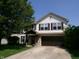 Charming two-story home with a well-manicured lawn and inviting front entrance, perfect for Gathering living at 2628 Newaygo Dr, Indianapolis, IN 46217
