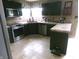 A detailed view of the kitchen with stainless steel appliances and dark cabinets with tile backsplash at 2628 Newaygo Dr, Indianapolis, IN 46217