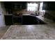 Kitchen counter with black sink, tile back splash, and tiled counter tops at 2628 Newaygo Dr, Indianapolis, IN 46217