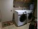 Bright laundry area featuring a new Samsung washer and dryer and overhead shelving at 2628 Newaygo Dr, Indianapolis, IN 46217