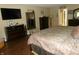 Well-lit main bedroom offers wood-look flooring, a sitting area, and en-suite bathroom at 2628 Newaygo Dr, Indianapolis, IN 46217