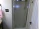 Bathroom shower with a translucent door and bronze hardware at 2628 Newaygo Dr, Indianapolis, IN 46217