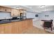 Finished basement featuring a kitchenette, dining area, and stainless steel appliances at 2898 Violet W Ct, Columbus, IN 47201