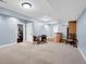 Spacious finished basement with neutral carpeting, bar area, and multiple entrances at 2898 Violet W Ct, Columbus, IN 47201