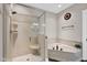Elegant bathroom boasting a glass-enclosed shower and a separate corner bathtub, creating a luxurious spa-like experience at 2898 Violet W Ct, Columbus, IN 47201
