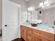 Bright bathroom featuring double sinks with bowl-shaped basins and wooden cabinets, offering both style and functionality at 2898 Violet W Ct, Columbus, IN 47201