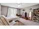Bright bedroom featuring a comfortable armchair and built in shelving, creating a cozy retreat at 2898 Violet W Ct, Columbus, IN 47201