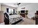 Comfortable bedroom with a coastal theme, ceiling fan, and ample natural light at 2898 Violet W Ct, Columbus, IN 47201