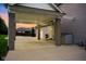 Covered carport featuring brick pillars and a concrete foundation at 2898 Violet W Ct, Columbus, IN 47201