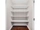 Walk-in closet featuring adjustable shelving and wood flooring at 2898 Violet W Ct, Columbus, IN 47201